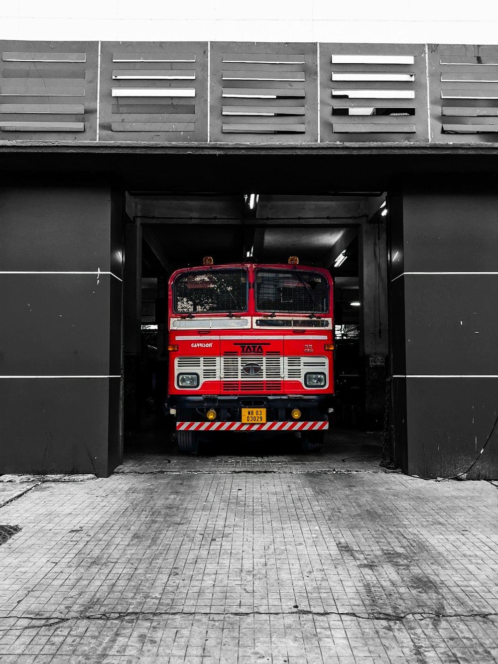 red blue and yellow bus in a tunnel