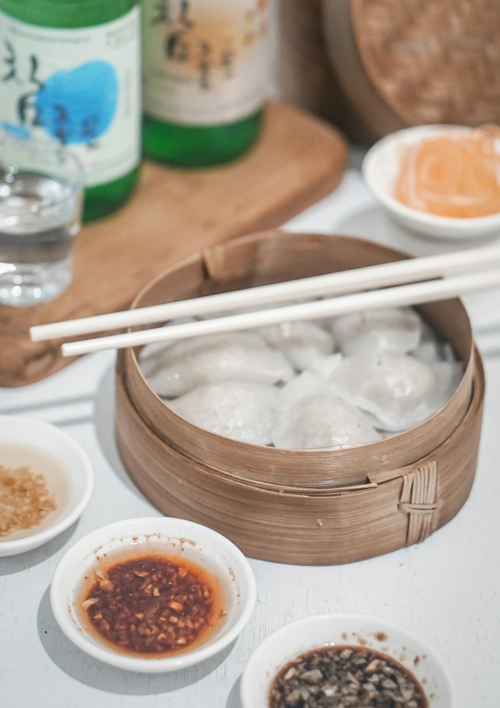 white chopsticks on brown wooden bowl