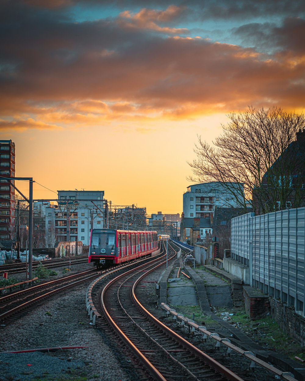 train rail near city buildings during daytime