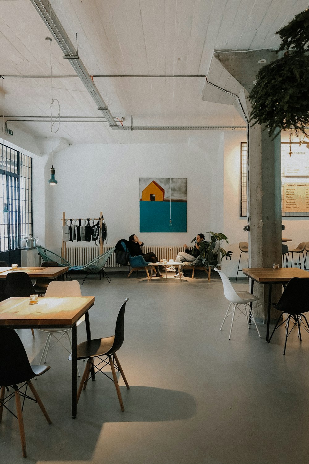 people sitting on chairs inside room