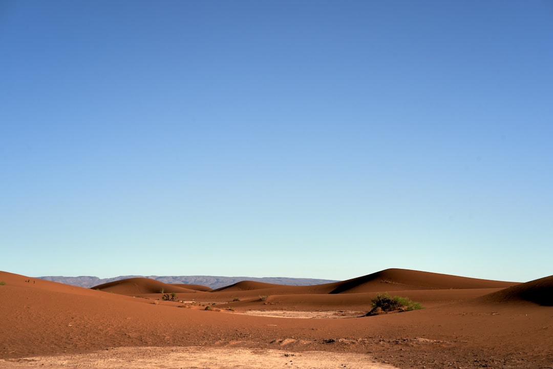 brown sand under blue sky during daytime