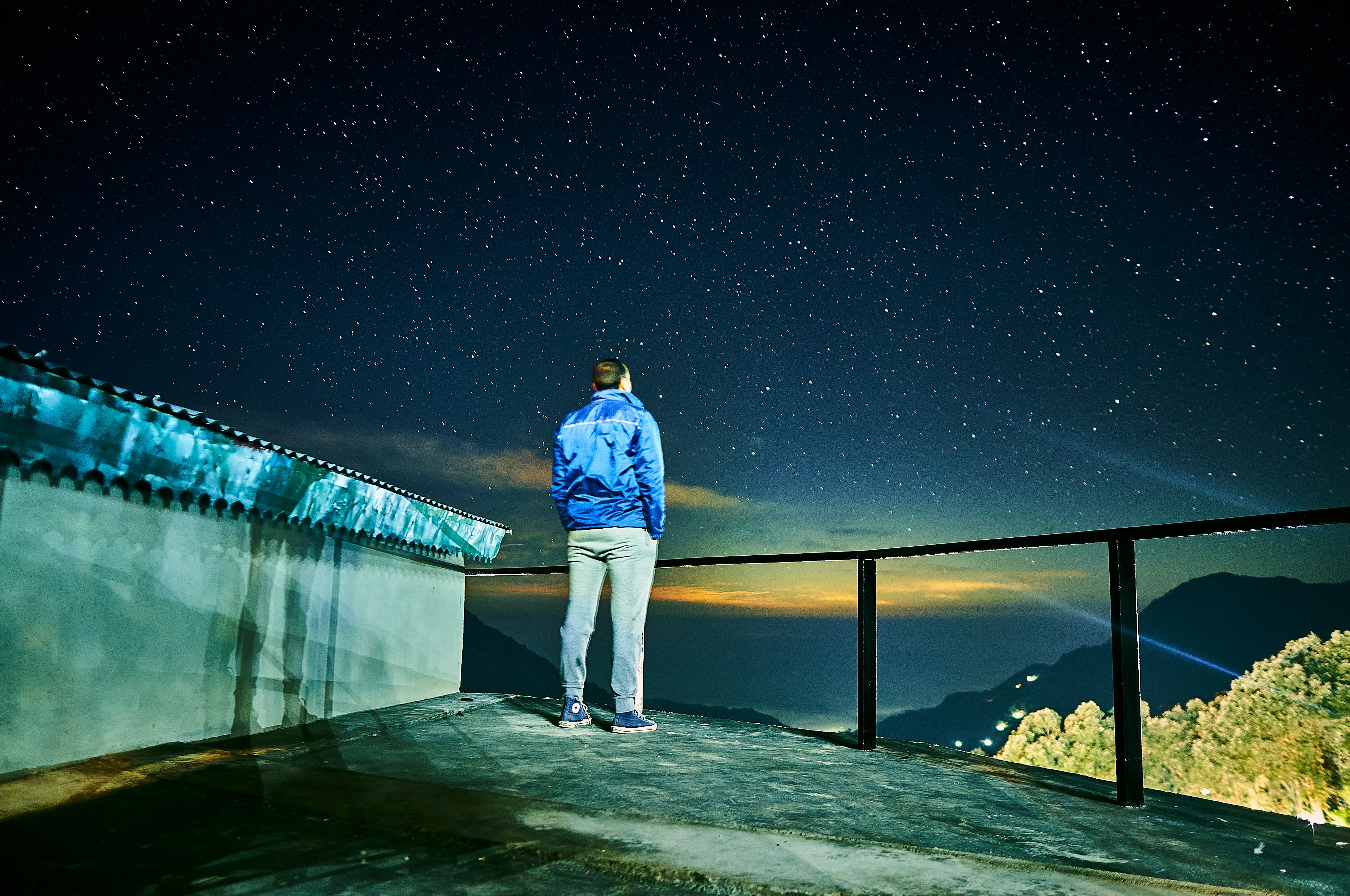 Man looking at starry sky
