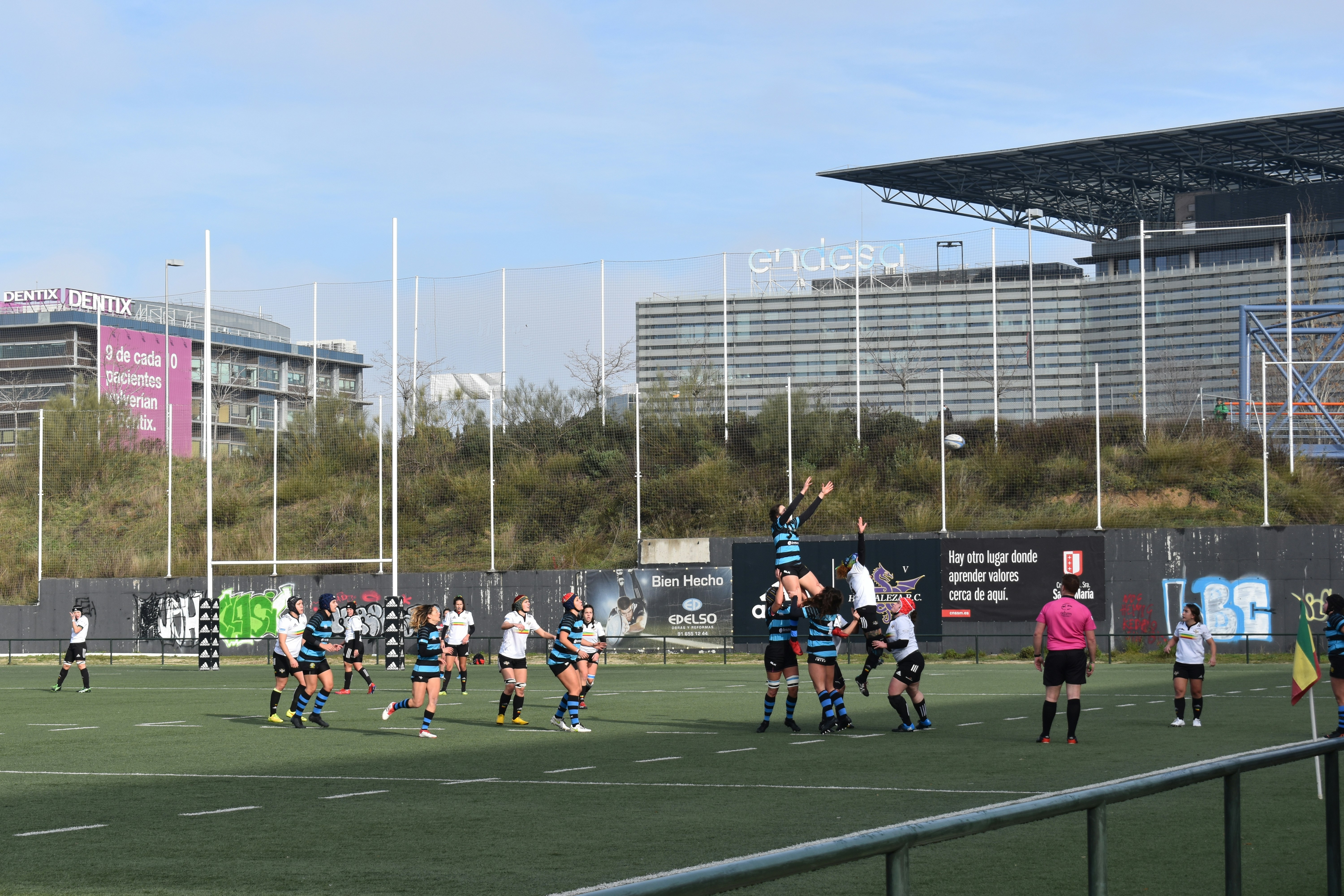 people playing soccer on field during daytime