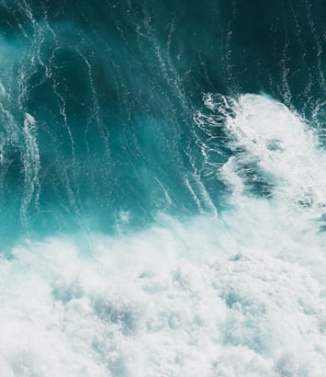 white and blue ocean waves