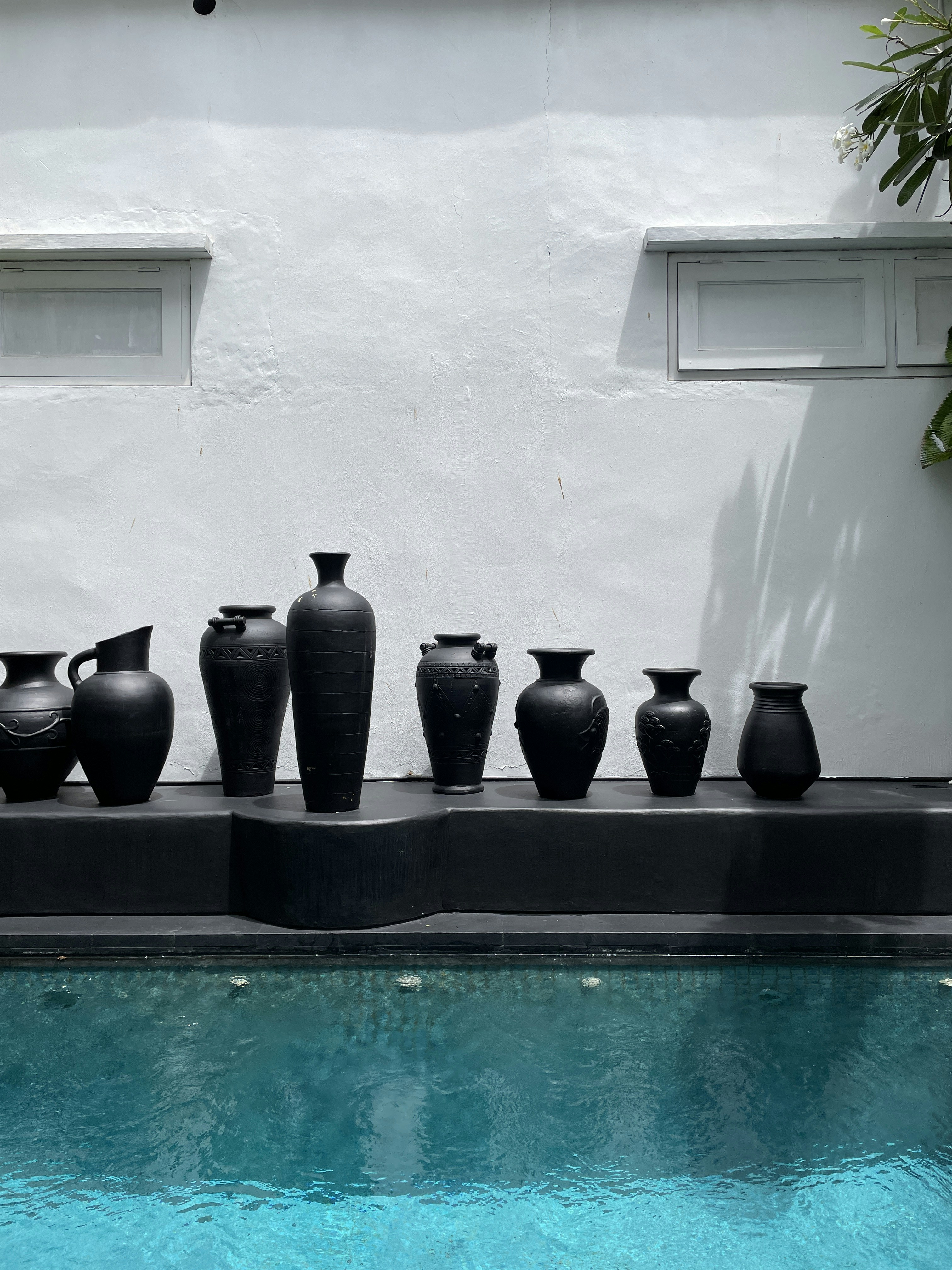 black clay pots on black ceramic vase