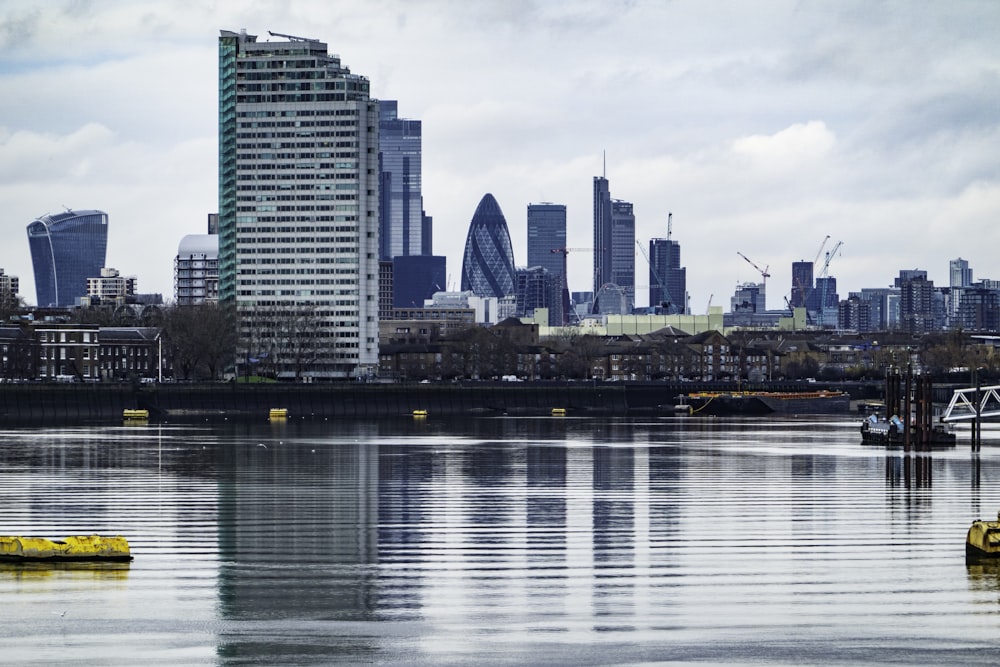 city skyline across body of water during daytime