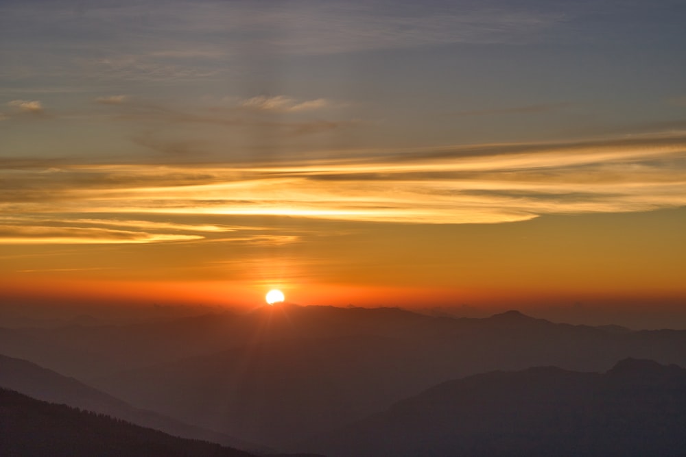 silhouette of mountains during sunset