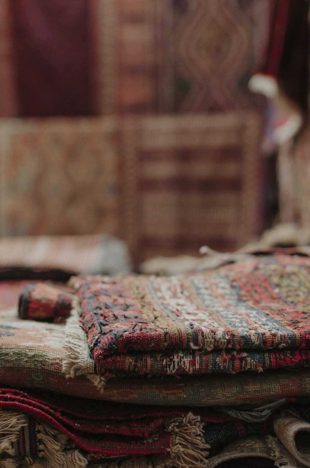 red and white textile on brown wooden table