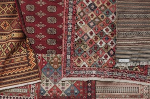 red white and black floral textile