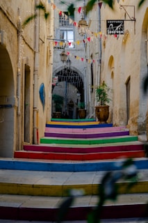multi color wooden bench near brown concrete building