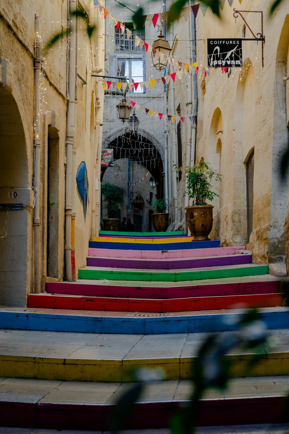 multi color wooden bench near brown concrete building