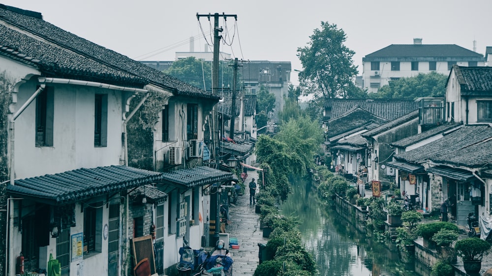 cars parked beside houses during daytime