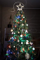 green christmas tree with baubles and string lights