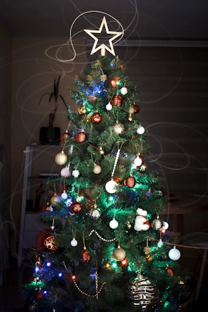 green christmas tree with baubles and string lights