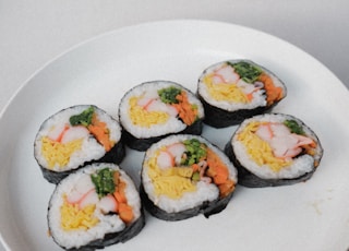 white ceramic plate with sushi