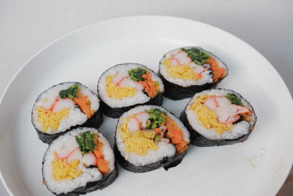 white ceramic plate with sushi