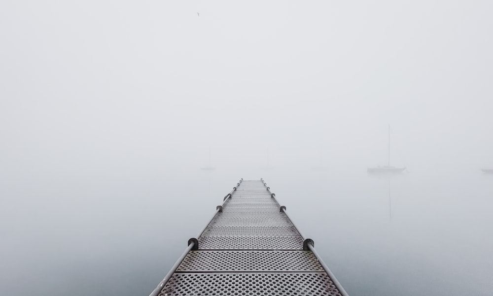 black and white building on foggy weather