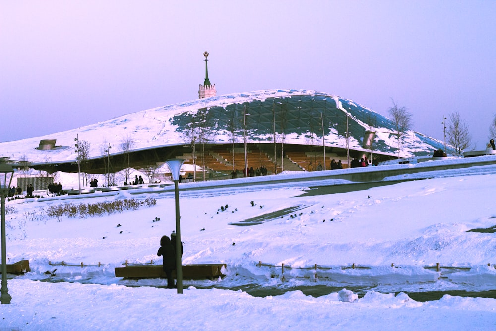 people walking on snow covered field during daytime