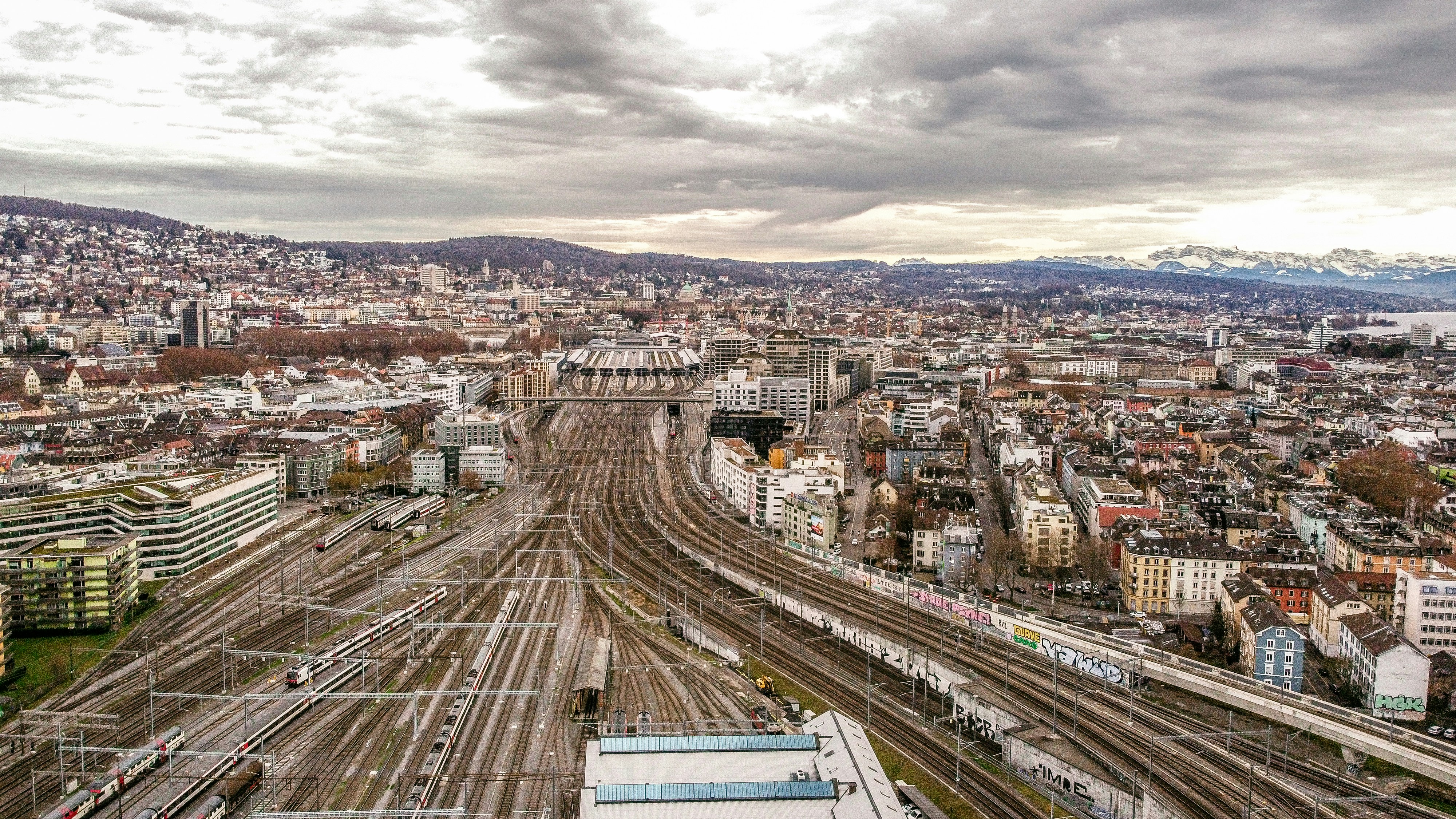 Aerial view of city buildings under cloudy sky during daytime photo ...