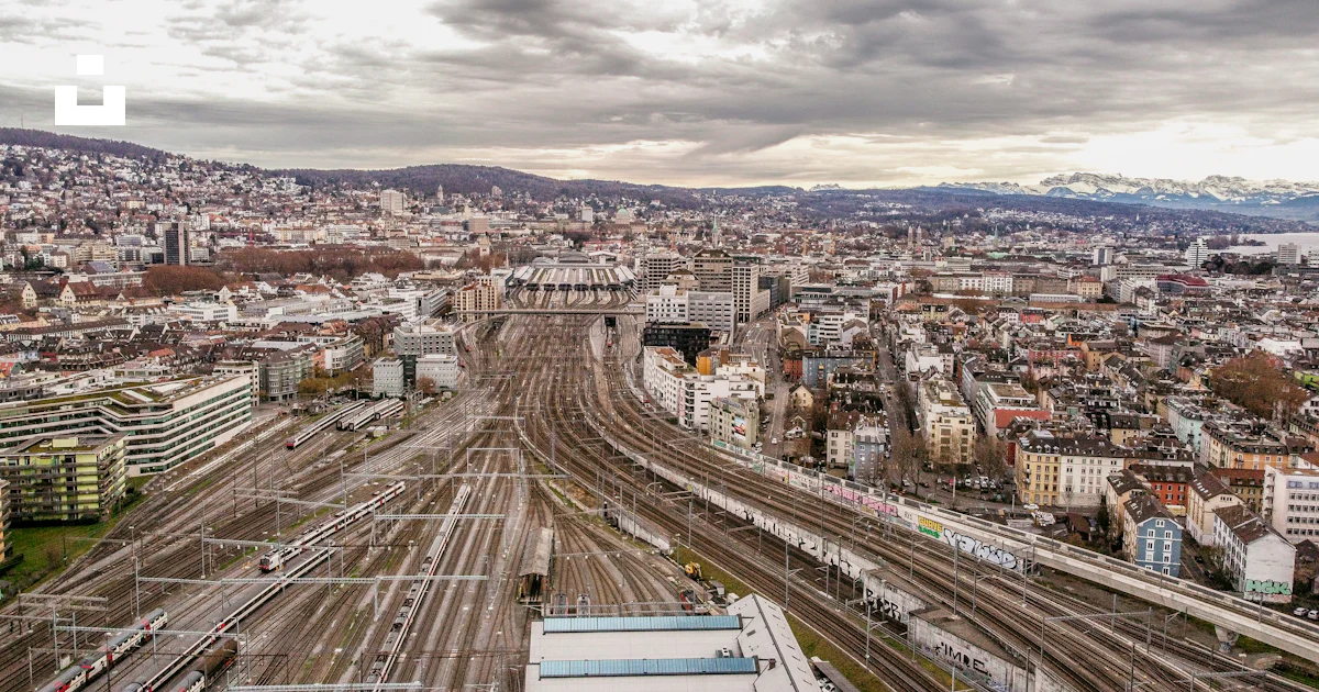 Aerial view of city buildings under cloudy sky during daytime photo ...