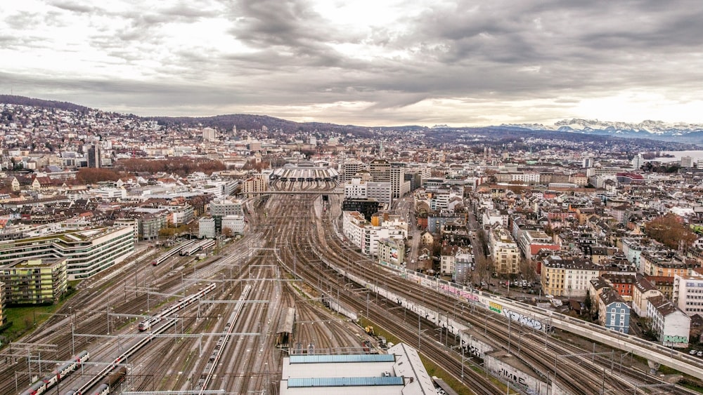 aerial view of city buildings under cloudy sky during daytime