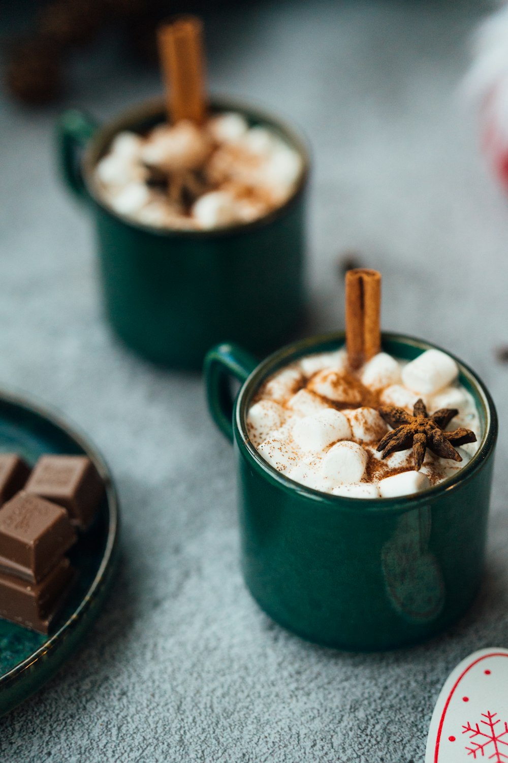 green ceramic mug with ice