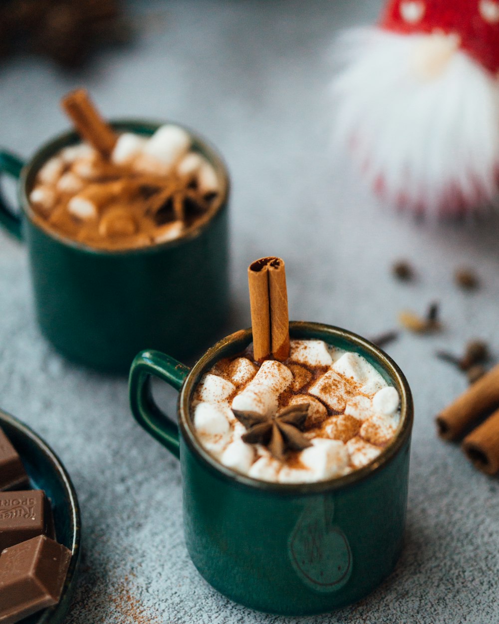 green ceramic mug with white and brown food