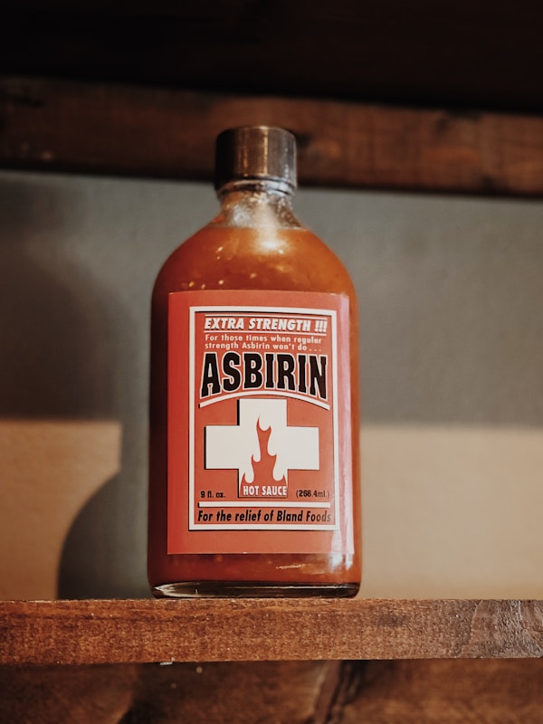 Heinz tomato ketchup bottle on brown wooden table