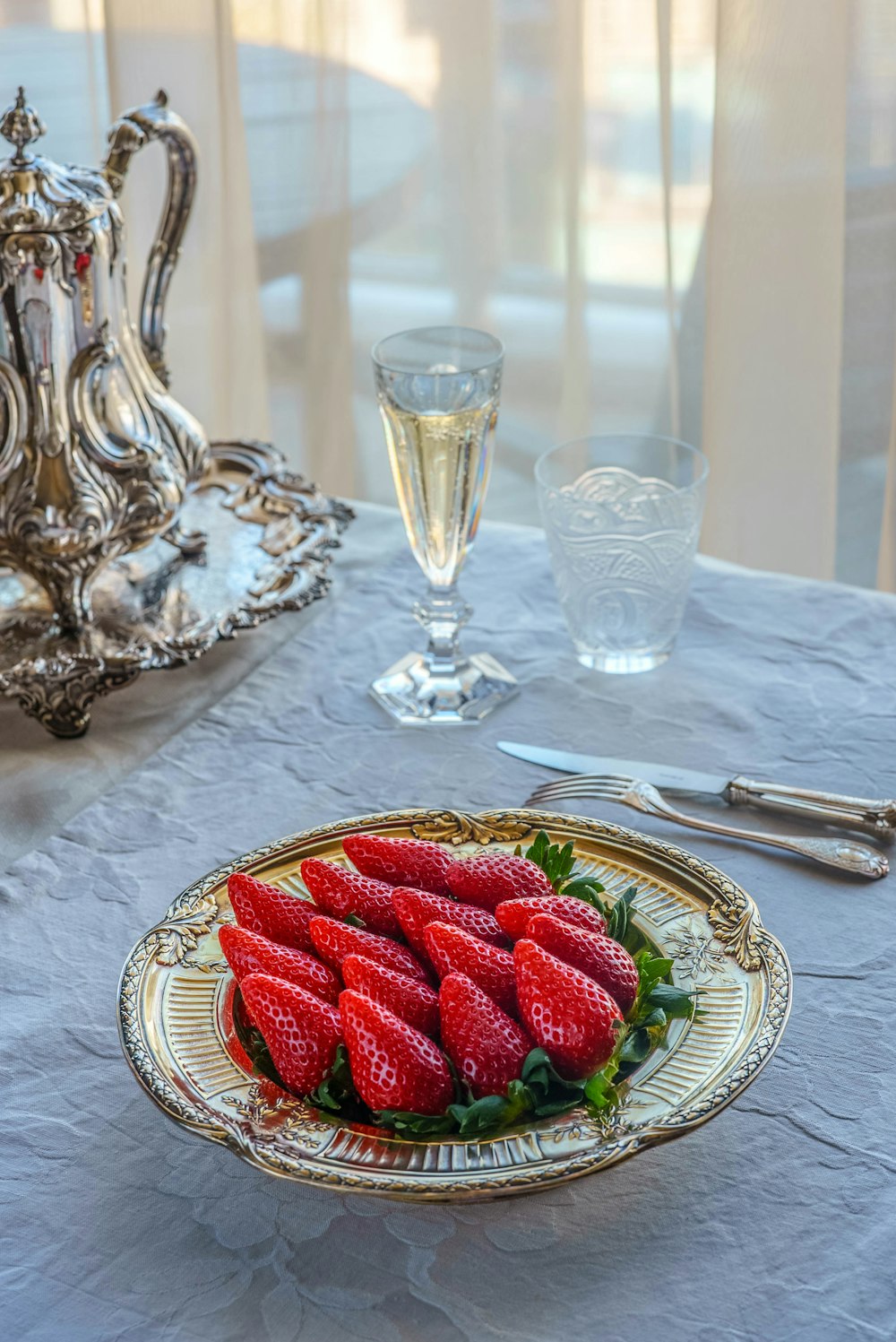 strawberries on white ceramic plate