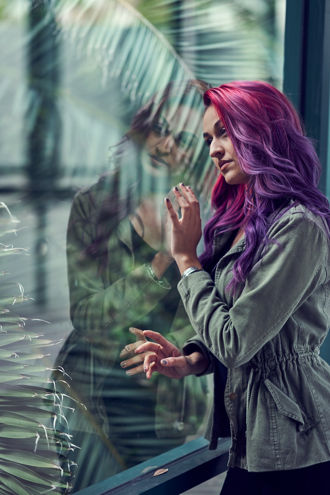 woman in black coat with purple hair