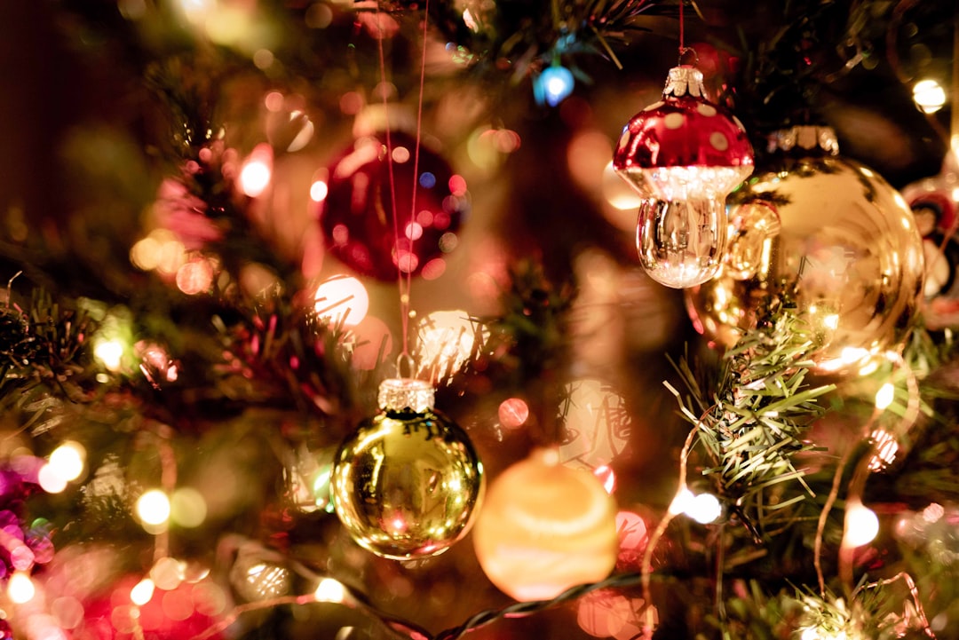 red and yellow baubles on green christmas tree