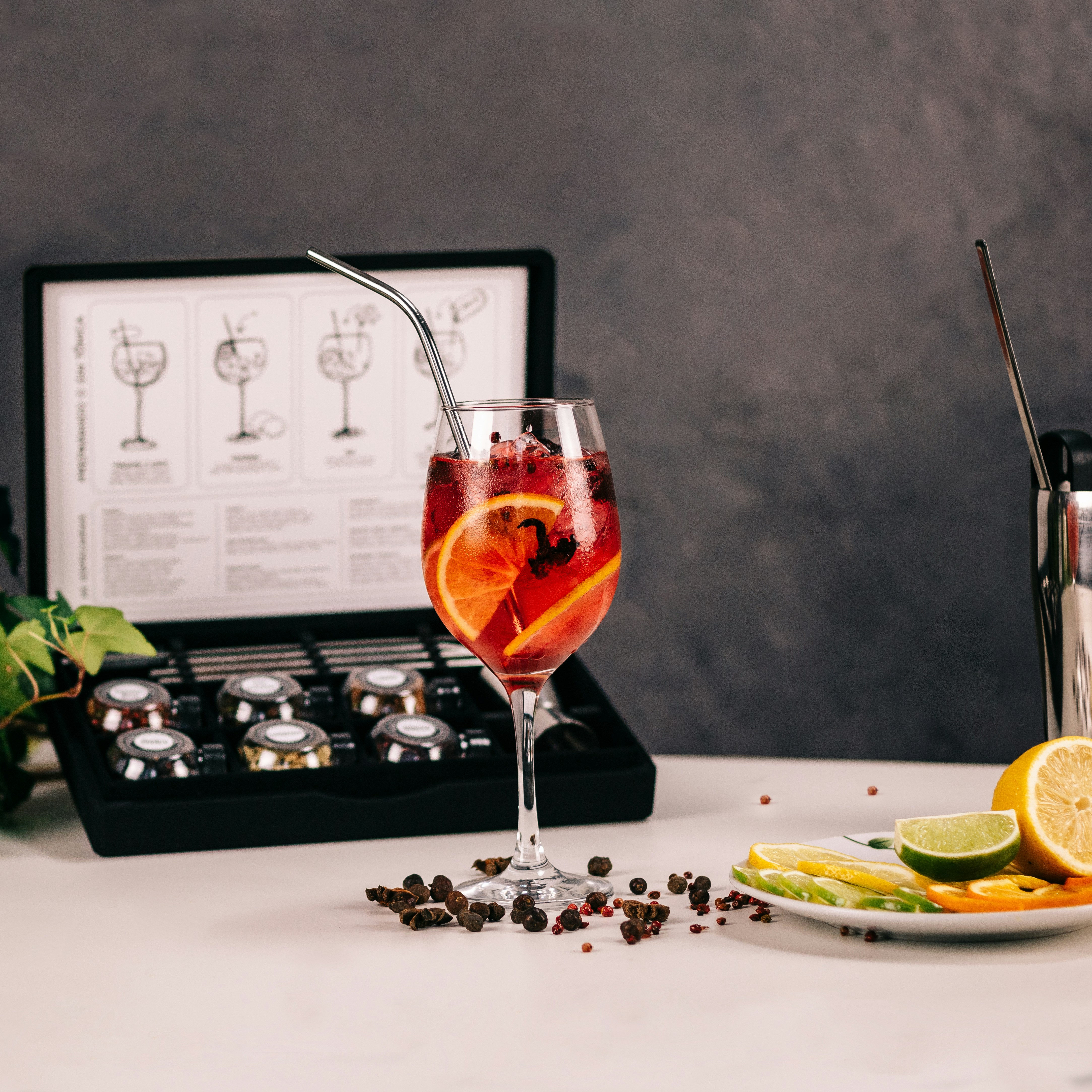 clear wine glass with red wine on white table