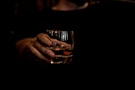 person holding clear drinking glass