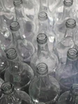 clear glass bottles on brown wooden table