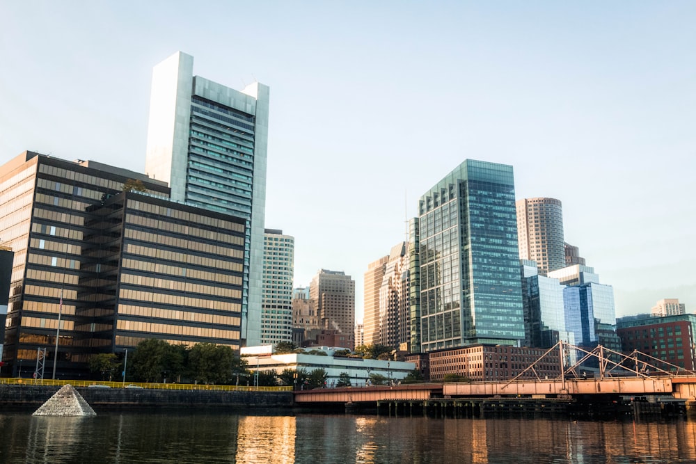 city skyline near body of water during daytime