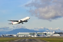 white passenger plane on airport during daytime