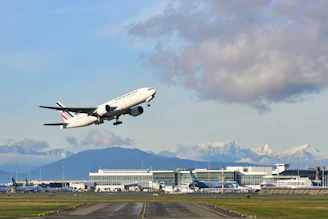 white passenger plane on airport during daytime