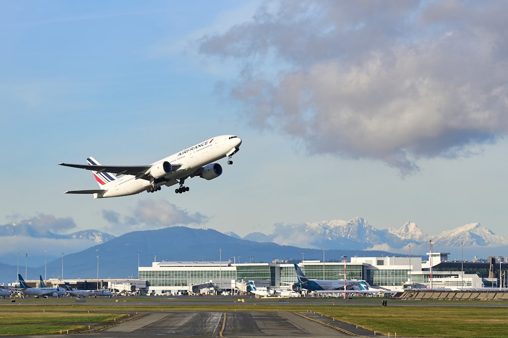 white passenger plane on airport during daytime