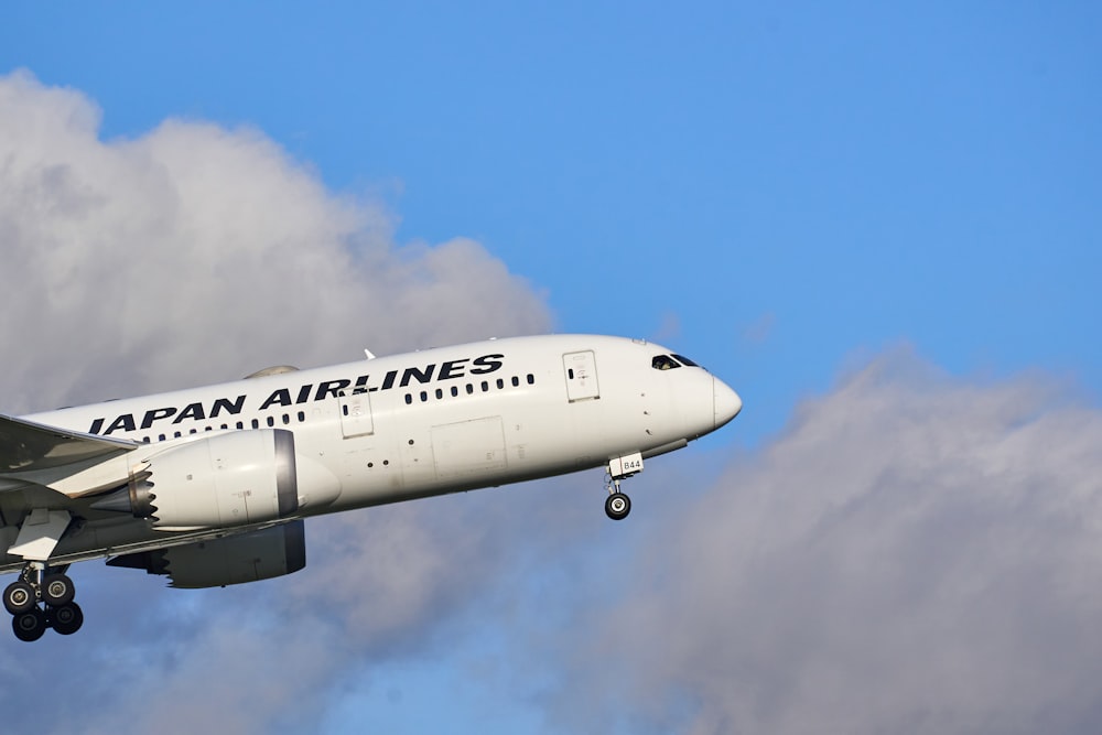 white passenger plane in the sky