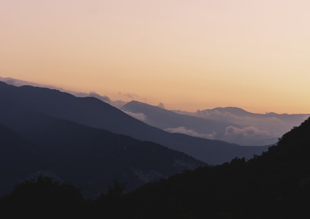 silhouette of mountains during sunset