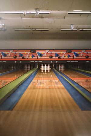 A row of bowling lanes lit up in a modern bowling center, similar to the 20 lanes planned at the Henderson complex