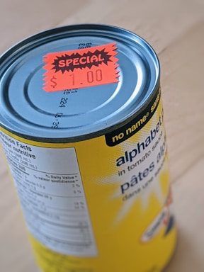 yellow and white labeled can