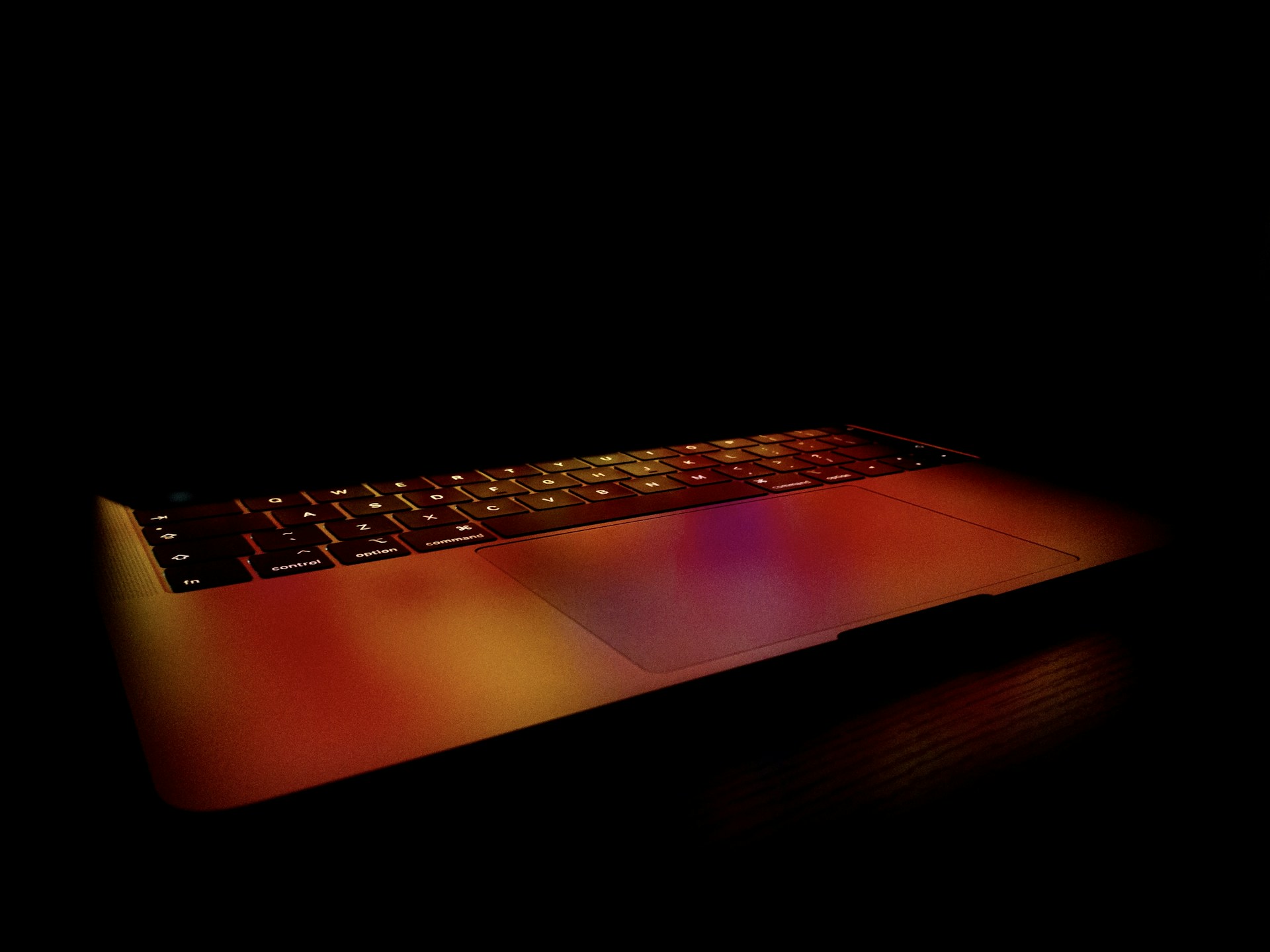 black and orange laptop computer