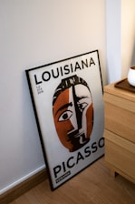 a poster of a woman's face on a wall