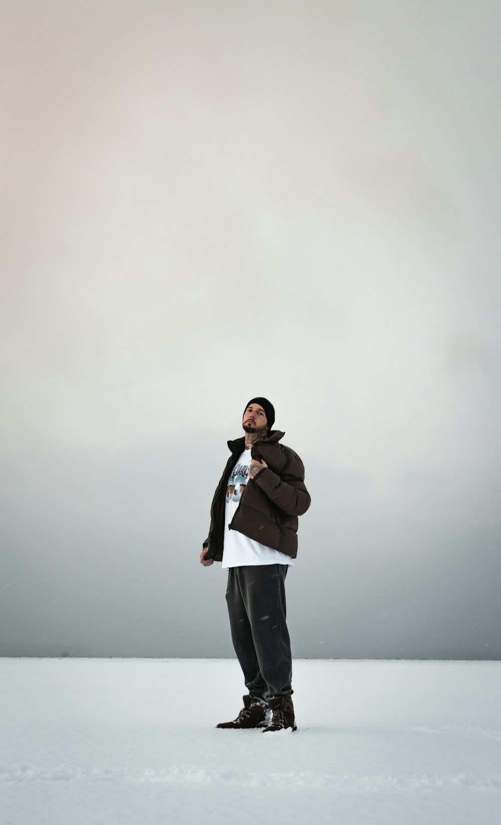 woman in black jacket and black pants standing on foggy weather