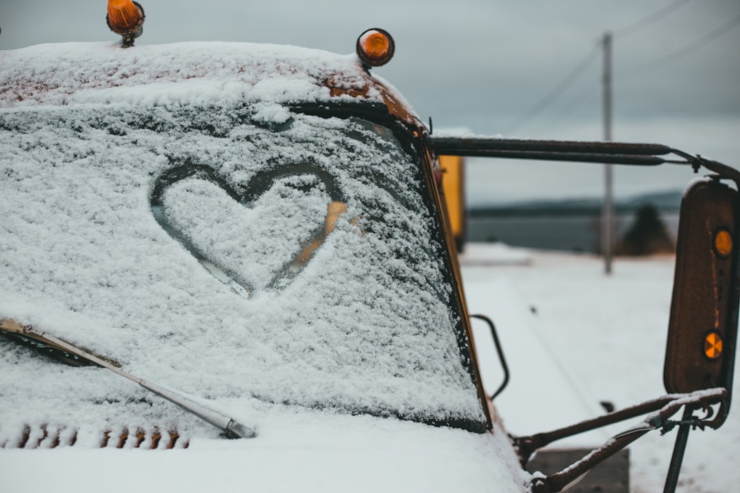 white snow on yellow car