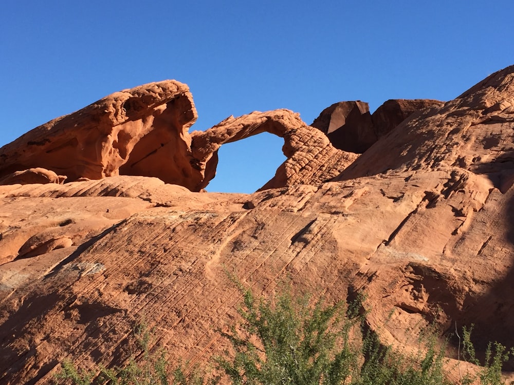 brown rock formation under blue sky during daytime