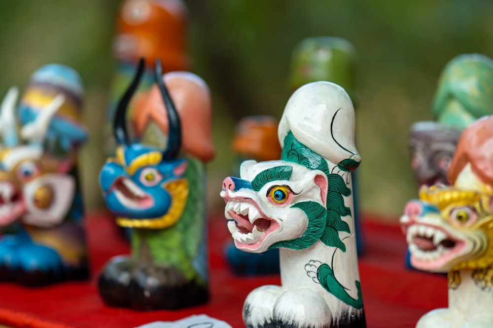 green and orange ceramic cat figurine