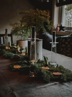 gray stainless steel candle holder on table