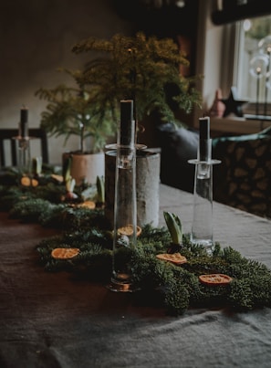 gray stainless steel candle holder on table